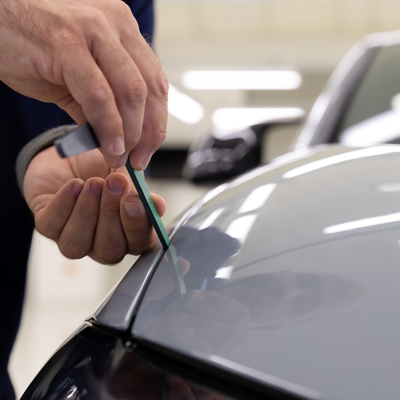 Fine work is carried out on a BMW vehicle