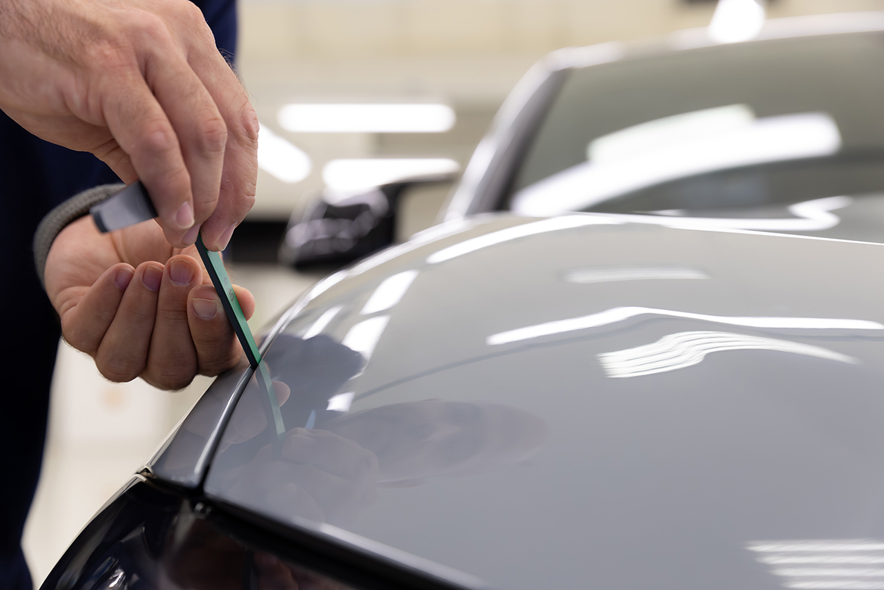 Fine work is carried out on a BMW vehicle