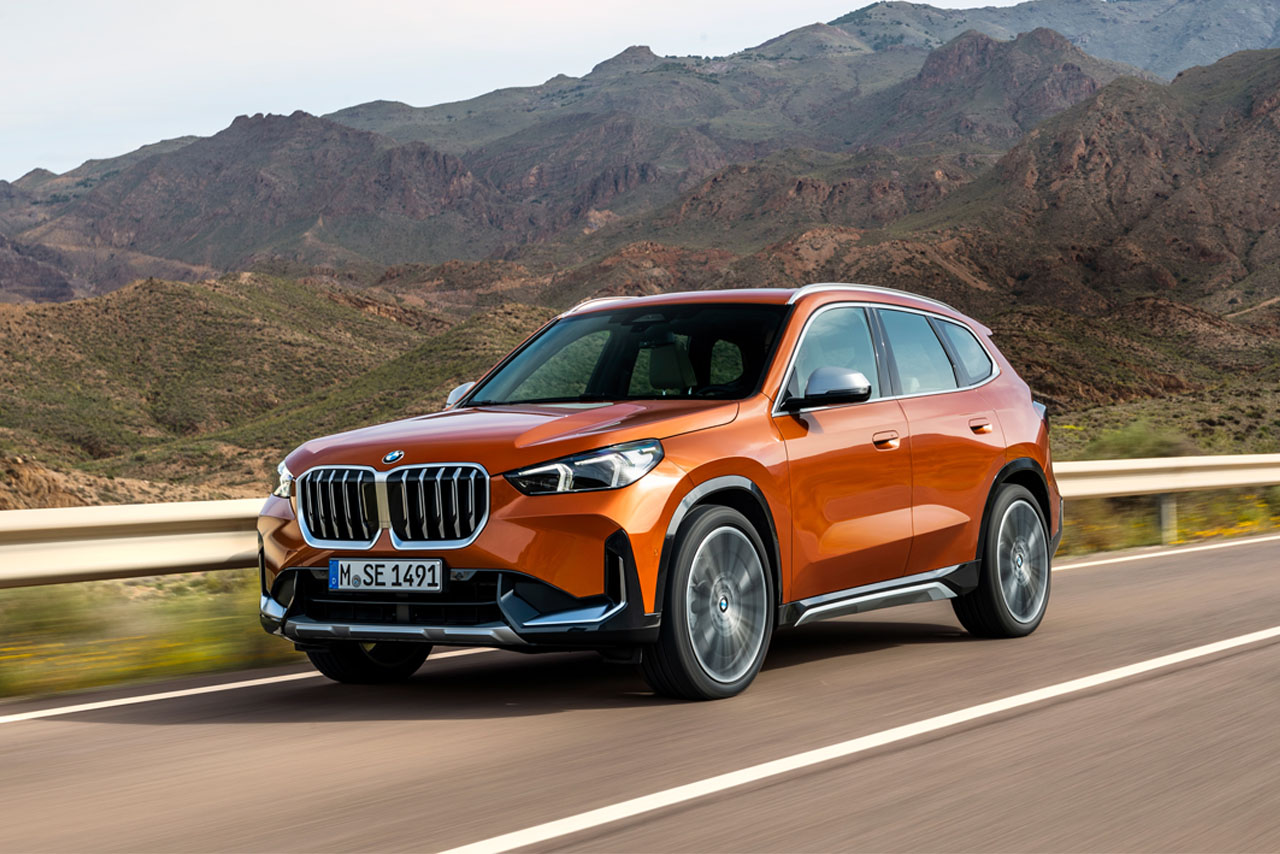 BMW X1 driving on a country road