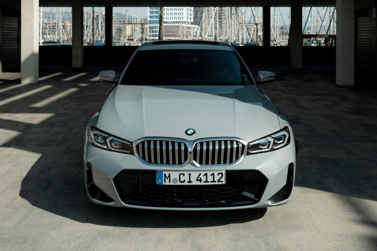  Grey BMW 3 series standing in a empty parking garage.