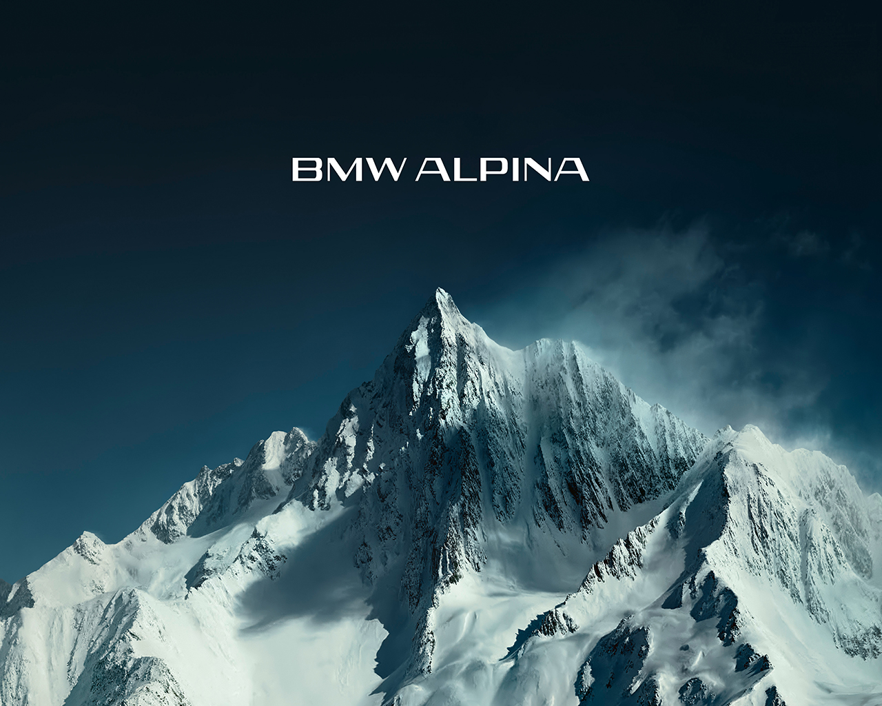 New BMW ALPINA logotype above snow-capped mountains.