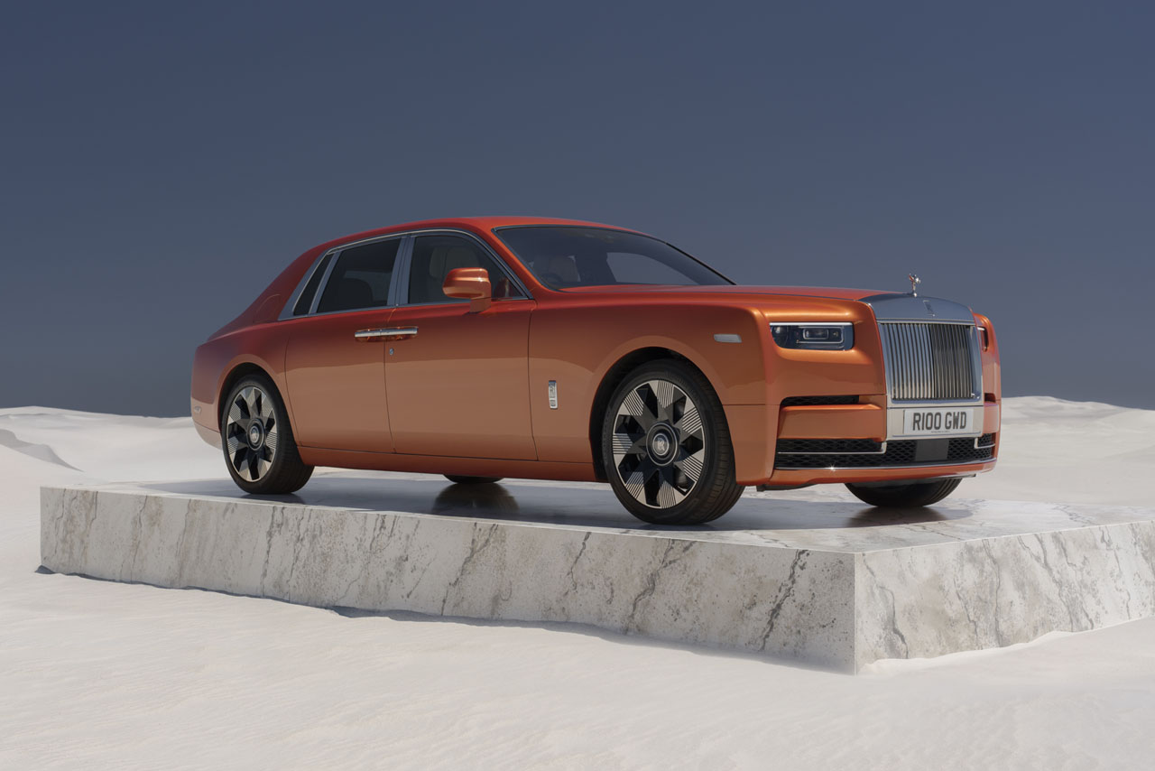  A sleek Rolls-Royce Phantom Phaeton parked elegantly, showcasing its luxurious design and iconic grille.