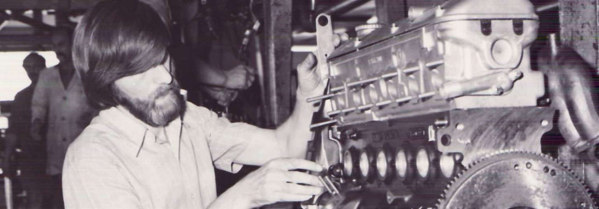 Factory workers in replacement engine production