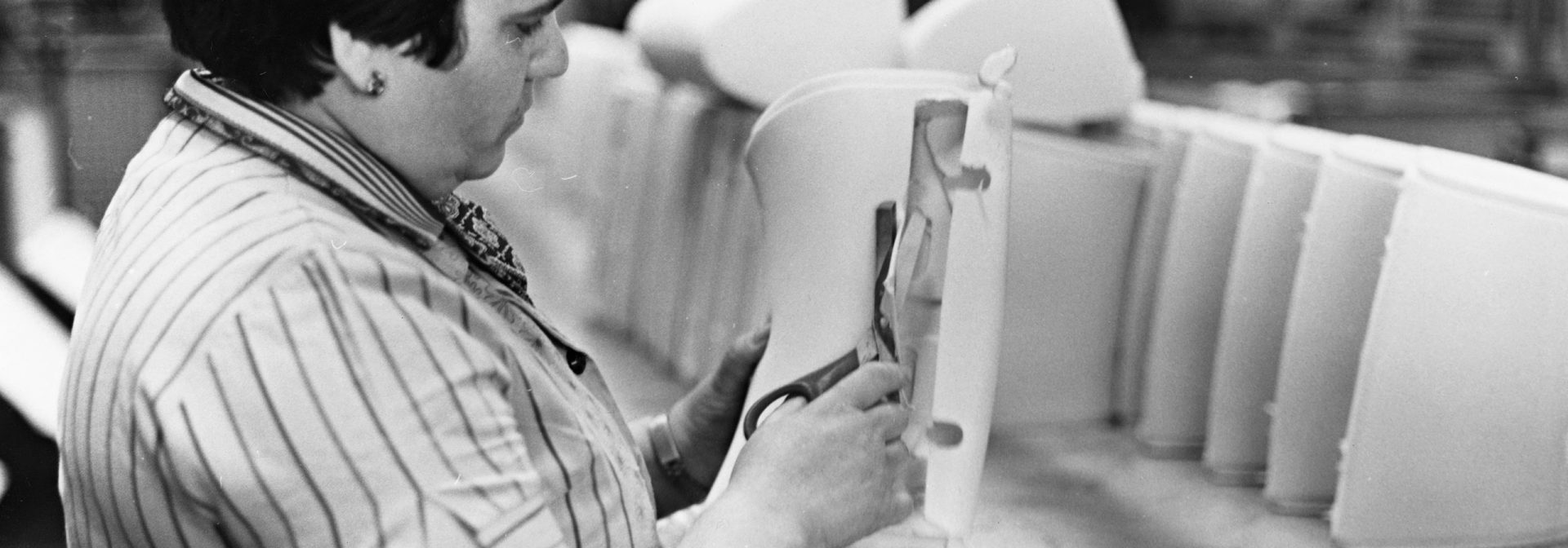 Factory worker manufactures seats