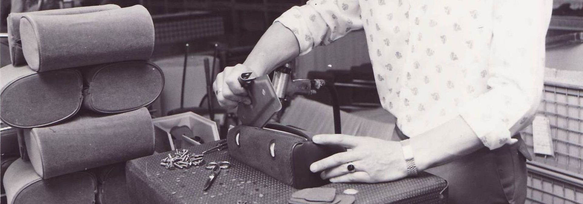 Factory worker manufactures seats