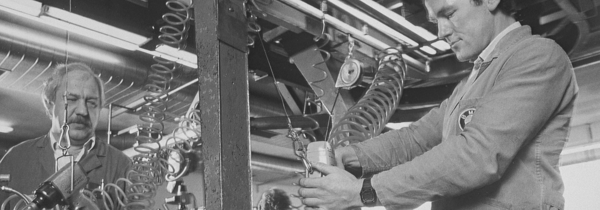 Factory workers in replacement engine production