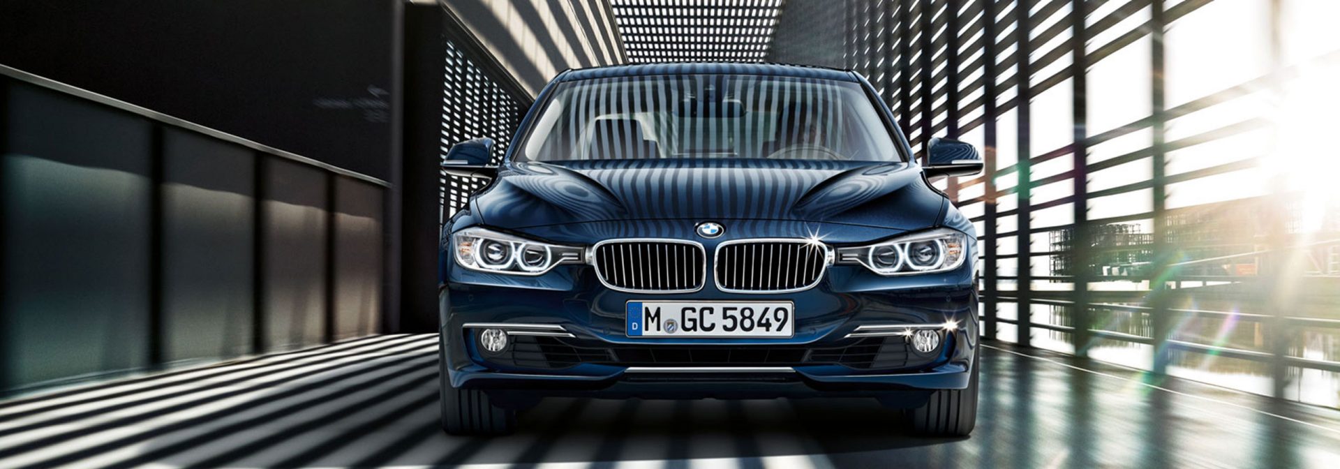 Front view of a blue BMW 3 Series with striking design and modern aesthetics.