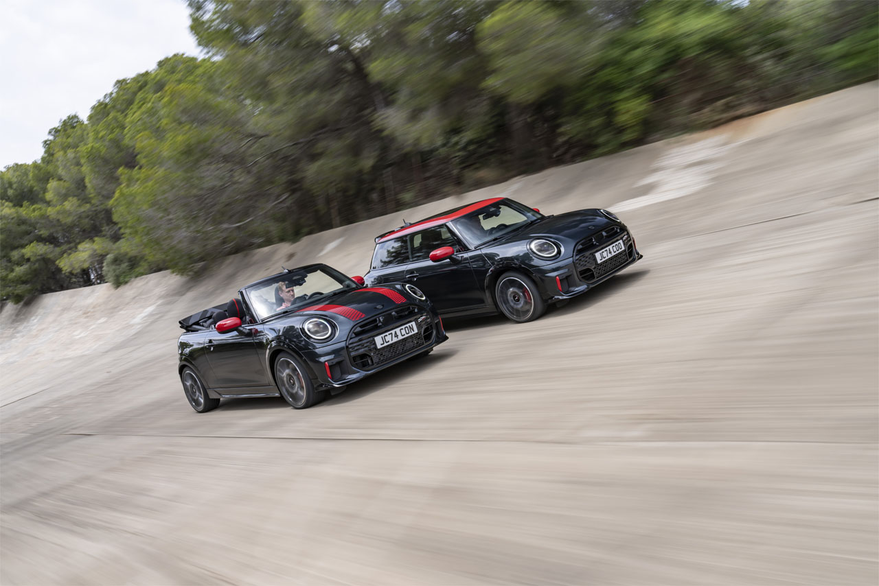 A Mini Cooper S and a Mini Cooper S Cabriolet parked side by side, showcasing their sporty designs and vibrant colors.