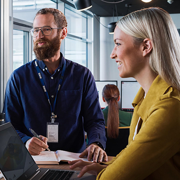 Two Professionals working together in a modern office environment.