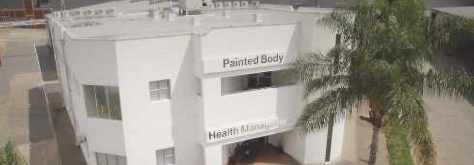 Exterior view of the hotel building showcasing its architecture and entrance.