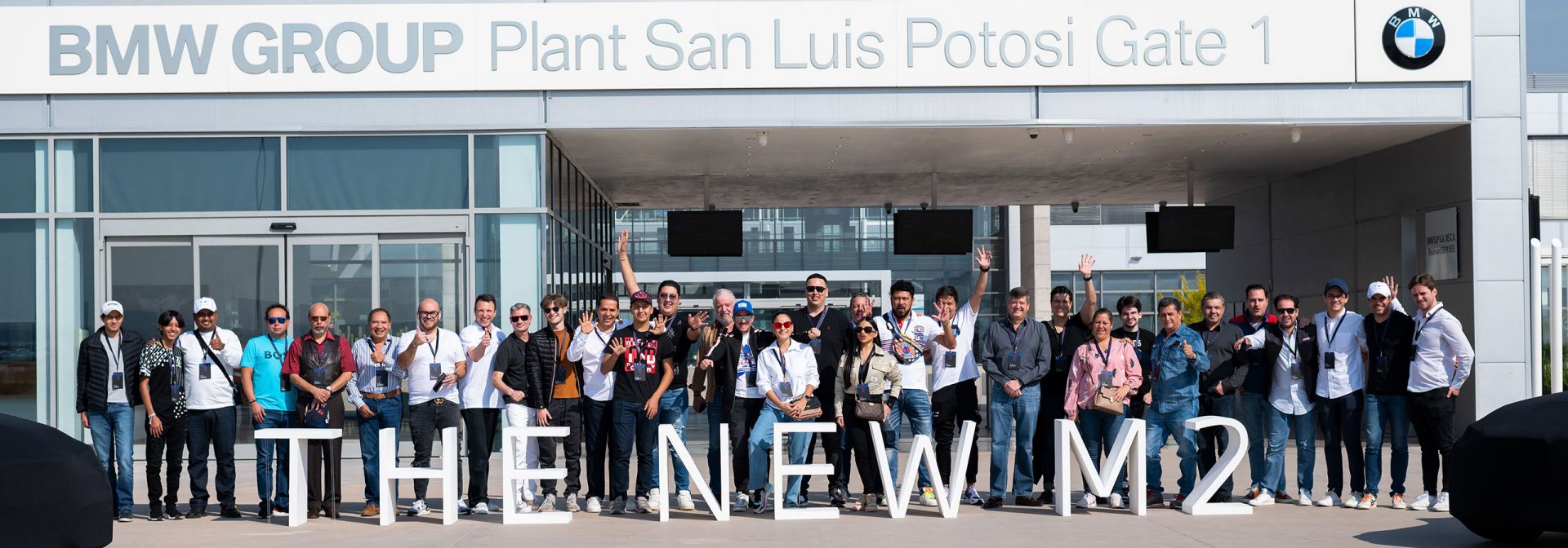 The first customers to receive the new BMW M2 posing for a group picture.