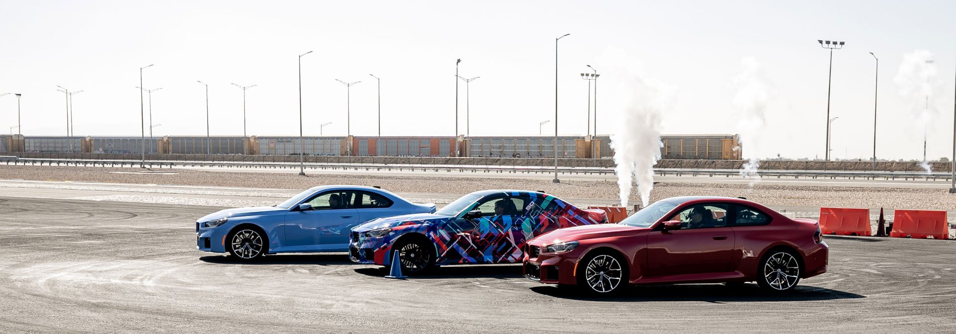 Three BMW M2 on a test track