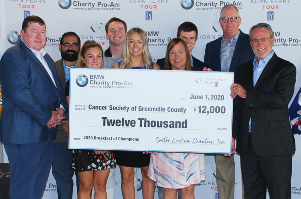 BMW Charity Pro-Am staff and board members hold the charity check for the Cancer Society of Greenville County, one of the six charities to benefit from the Tournament Week of Giving.