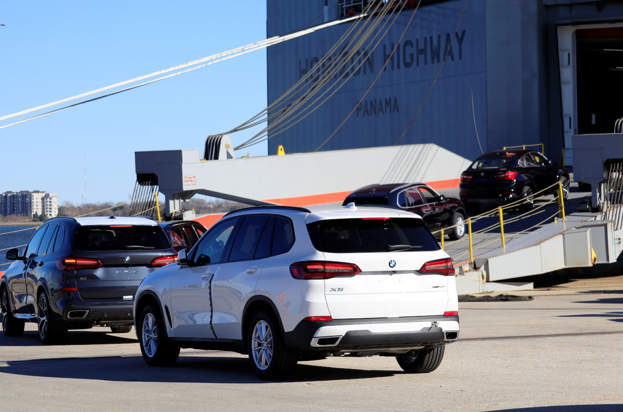 BMW X5 at the end of a long line of BMW's being loaded on a ship at the Port of Charleston. 