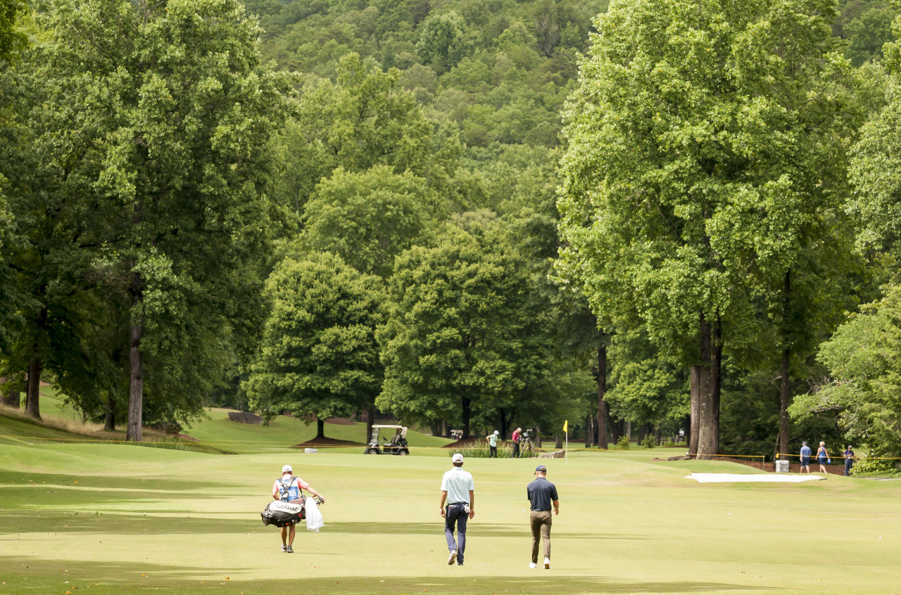 BMW Charity Pro-Am golf tournament players enjoy a beautiful course surrounded by nature. 