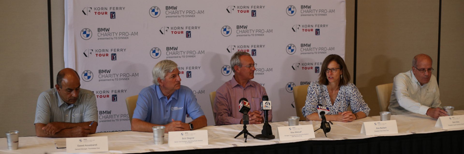 Press conference line up to announce golf tournament extension. 
