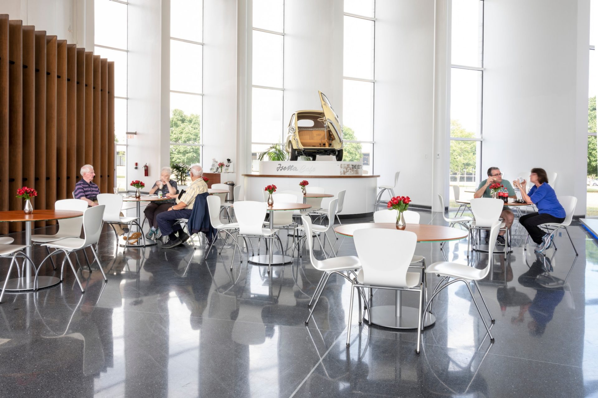 Guests sitting at tables in the Isetta Cafe. 