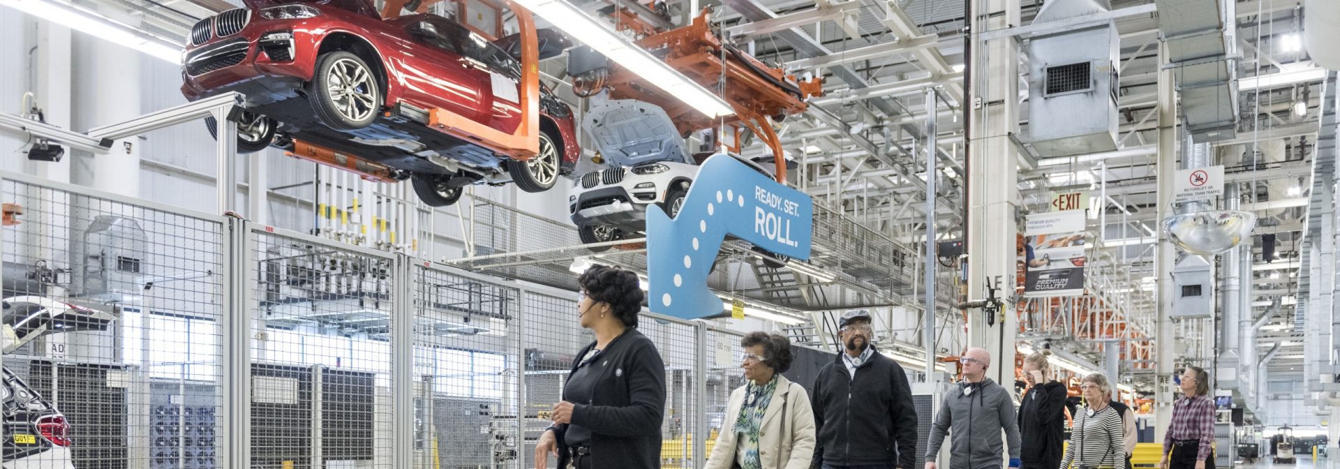 Tour group in the factory at "wheels down" in the production process. 