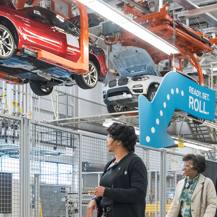 Tour group in the factory at "wheels down" in the production process. 