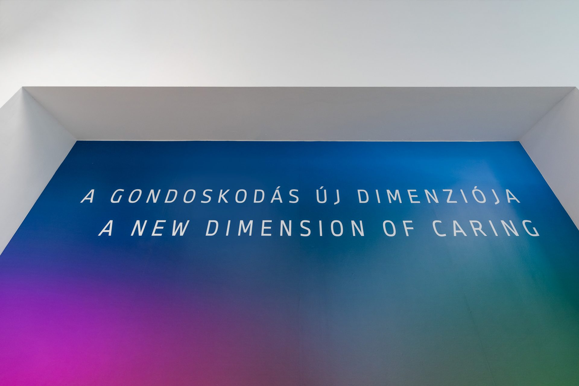 "A new dimension of caring" is written on the wall