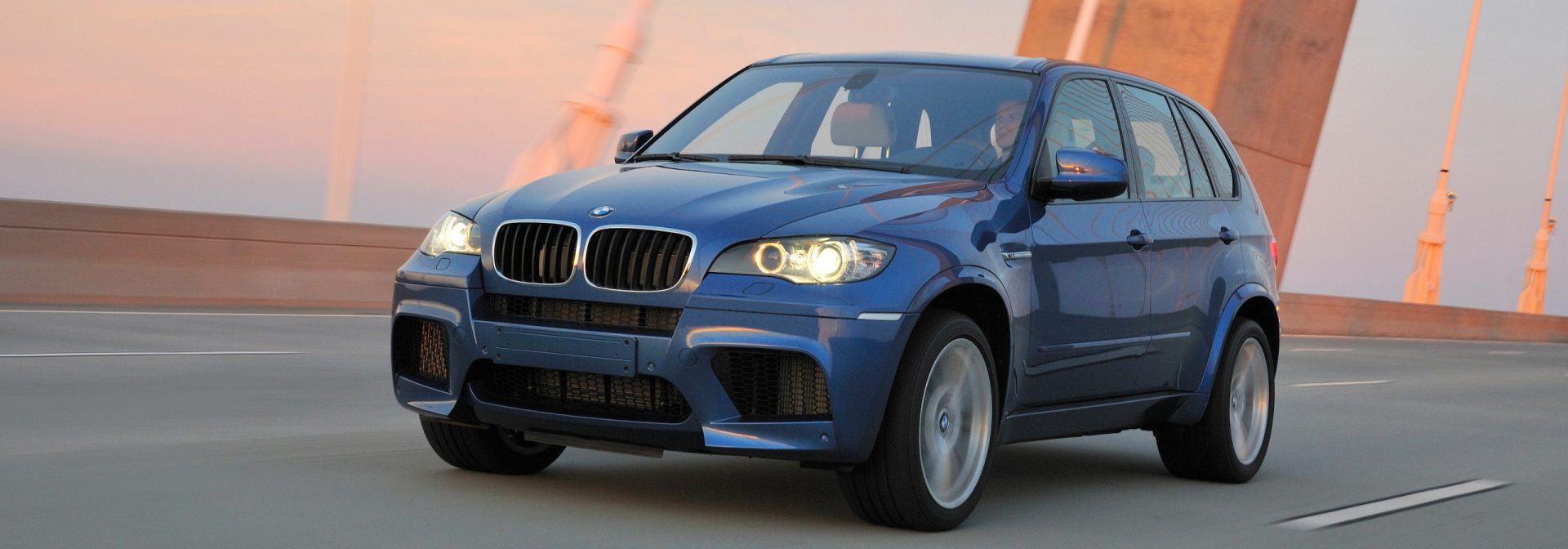 Beauty shot of the first BMW X5 M going over a bridge. 