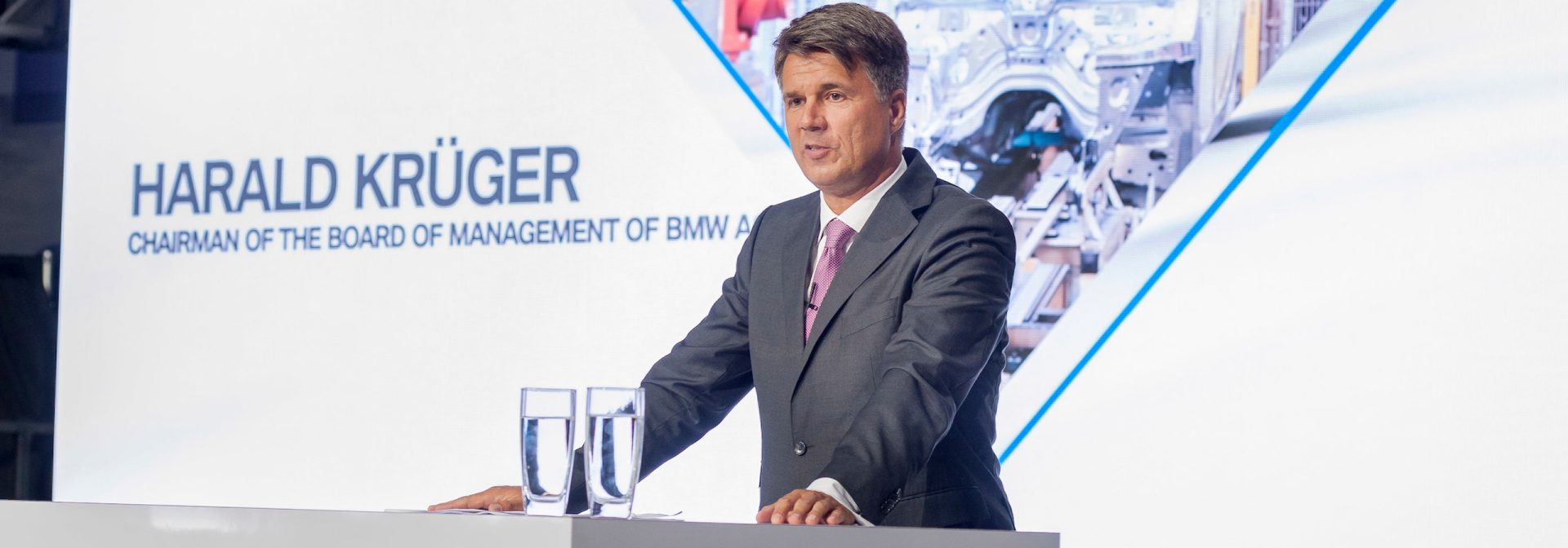 BMW Group Chairman of the Board of Management at press conference announcing additional invest and the addition of jobs. 